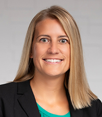 Woman smiling at camera.
