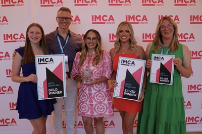 UFG IMCA Awards 2025 Five individuals smiling, holding awards.