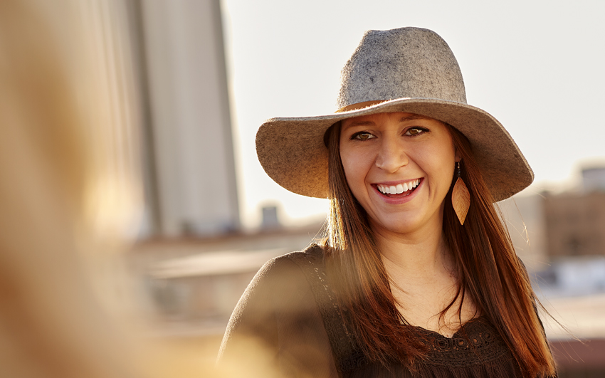 Employee smiling at sunset