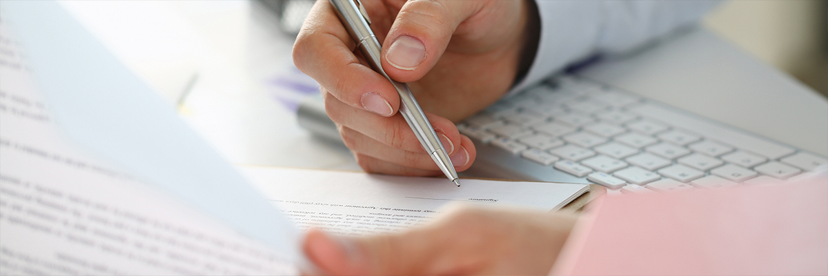 insurance underwriter examining documents