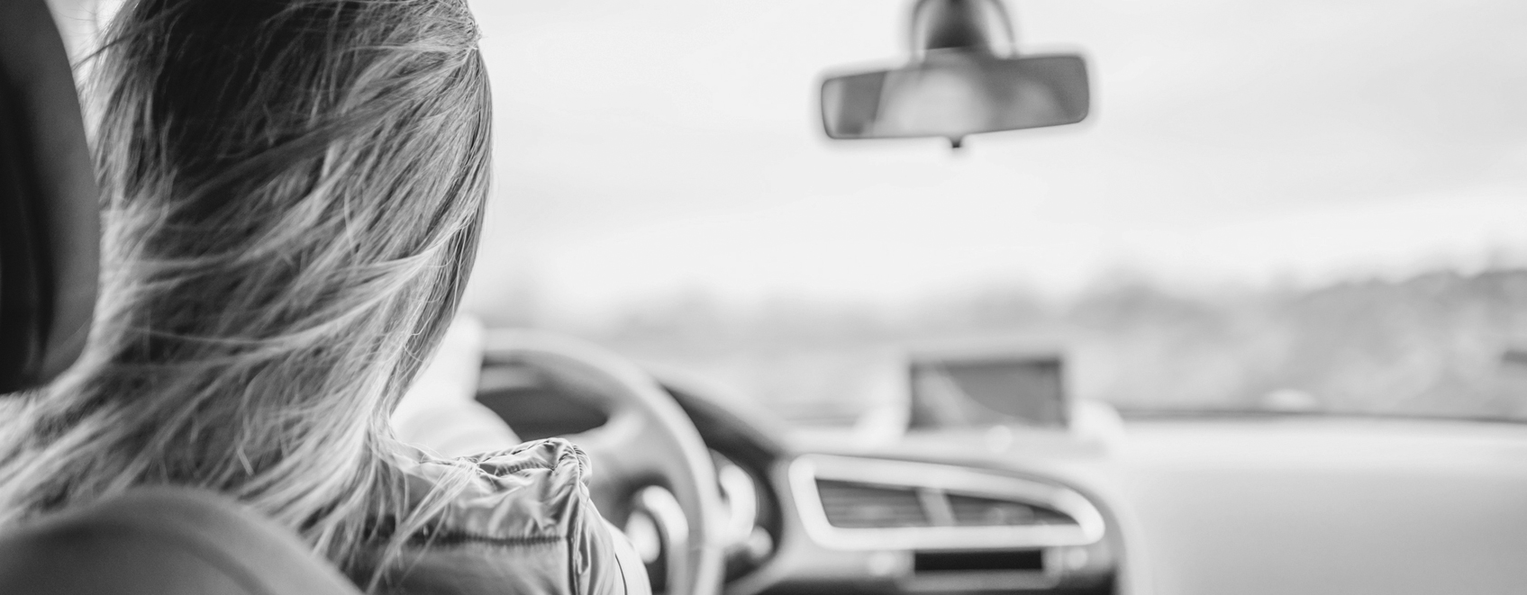 teenager driving in a car