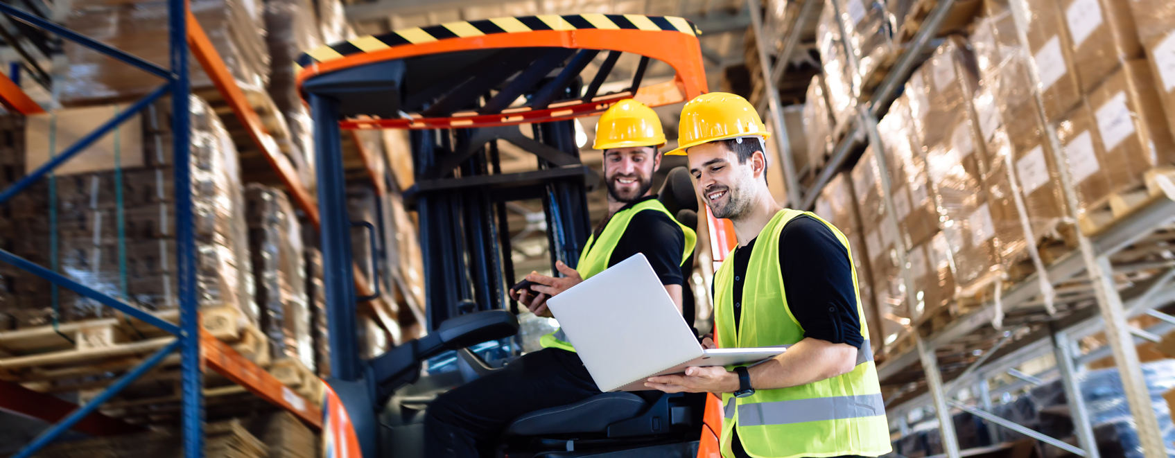 2 men in a warehouse 