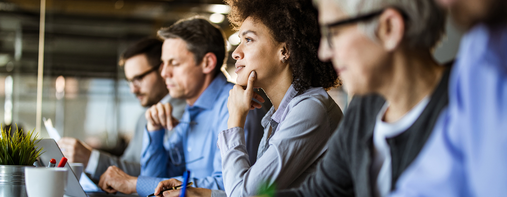 row of business people sitting at a training