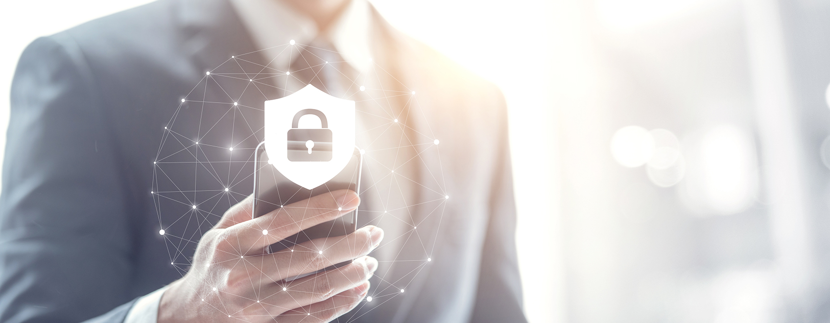 Person holding a smart phone, with an image of a padlock on it.